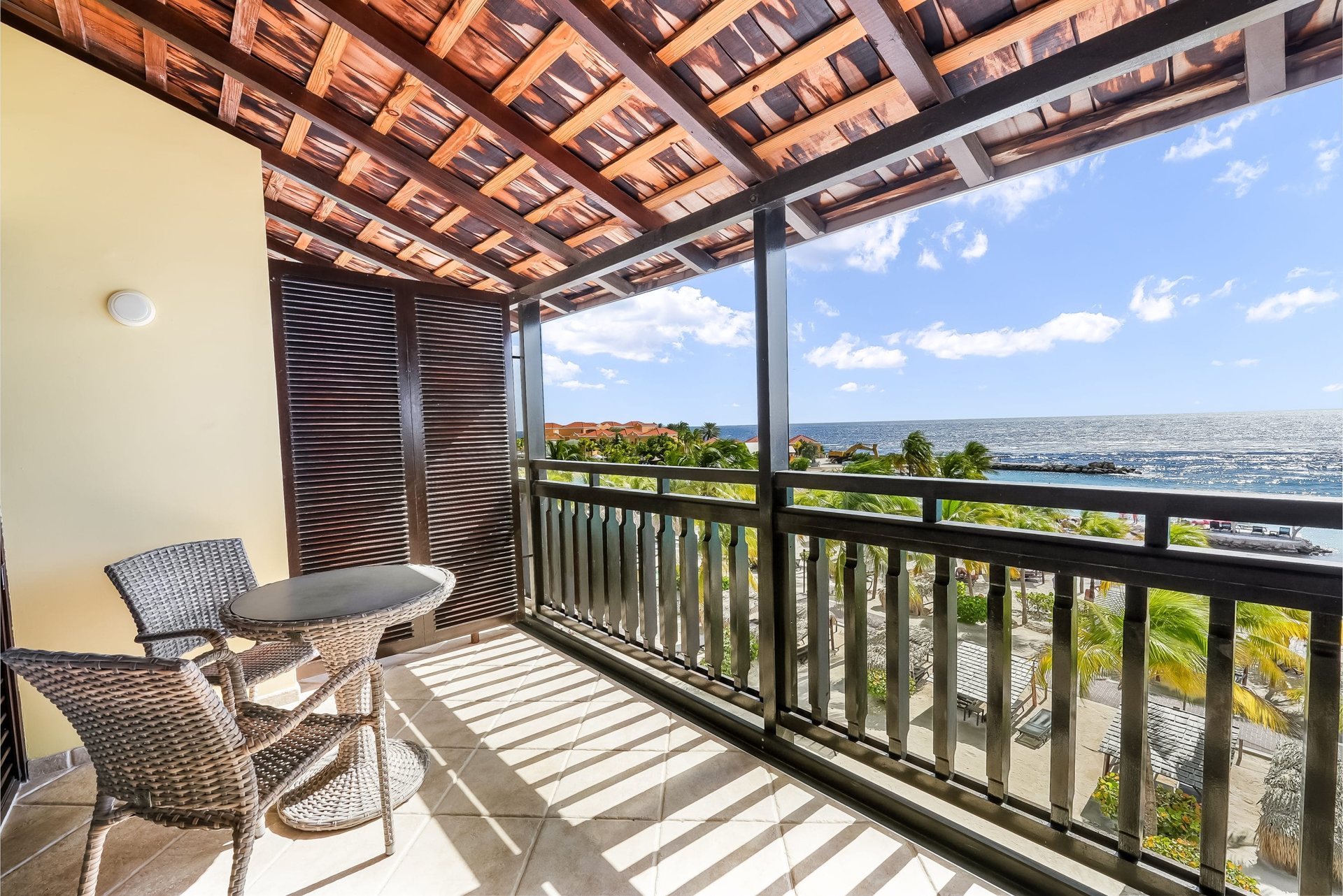 Oceanfront room balcony, LionsDive Beach Resort